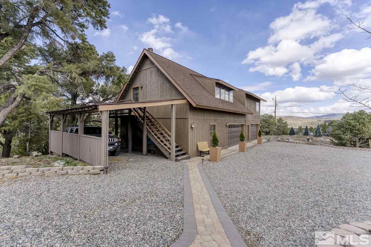 2330 Enterprise Road Reno, NV 89521 - Photo 13 of 40 a view of a house with a yard and wooden fence