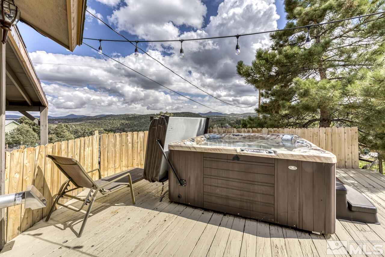 2330 Enterprise Road Reno, NV 89521 - Photo 18 of 40 a view of a balcony with wooden floor and iron fence