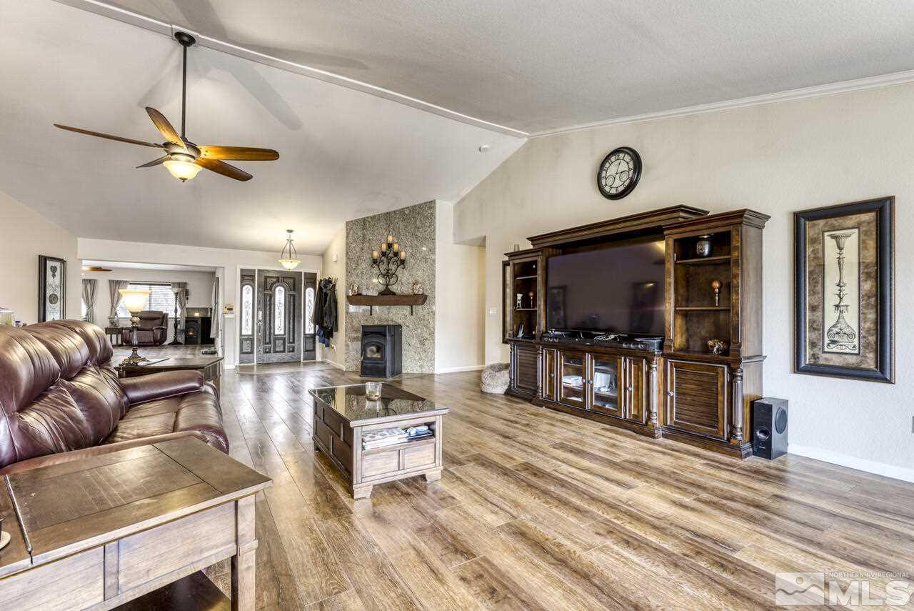 2330 Enterprise Road Reno, NV 89521 - Photo 34 of 40 a living room with furniture and a flat screen tv