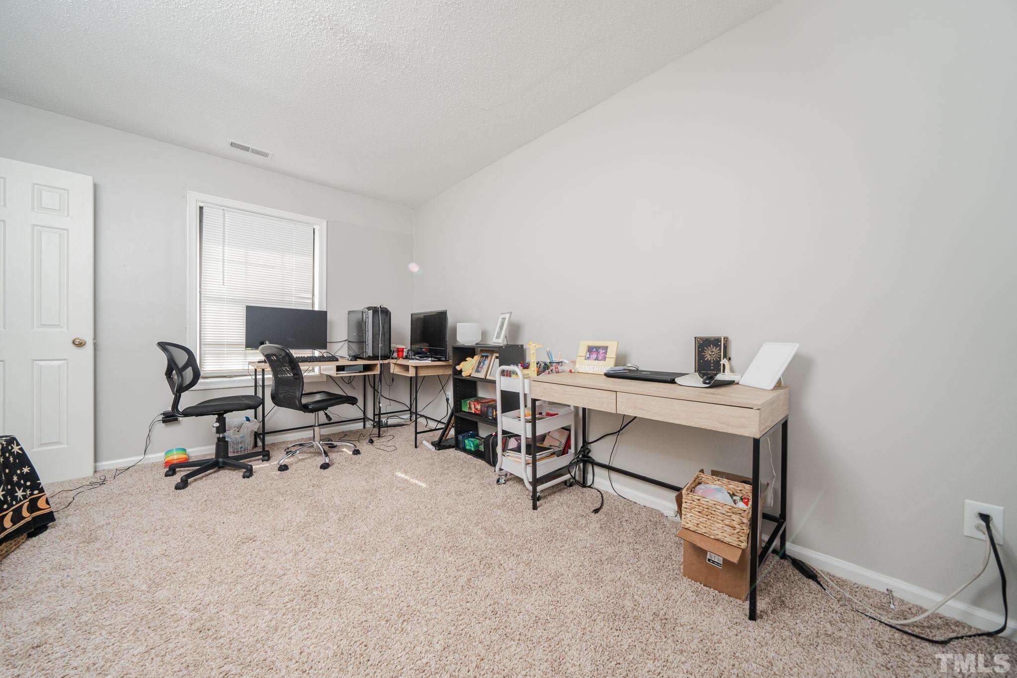 4304 Presley Court Raleigh, NC 27604 - Photo 12 of 34 a view of a workspace with a window and sitting area