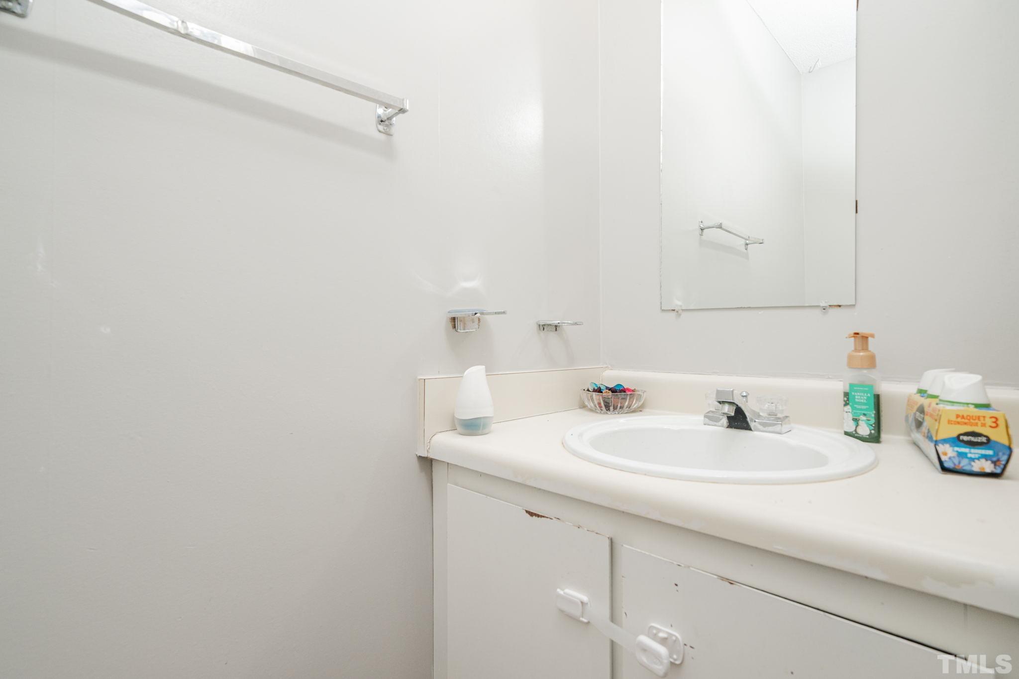 4304 Presley Court Raleigh, NC 27604 - Photo 13 of 34 a bathroom with a sink and a mirror