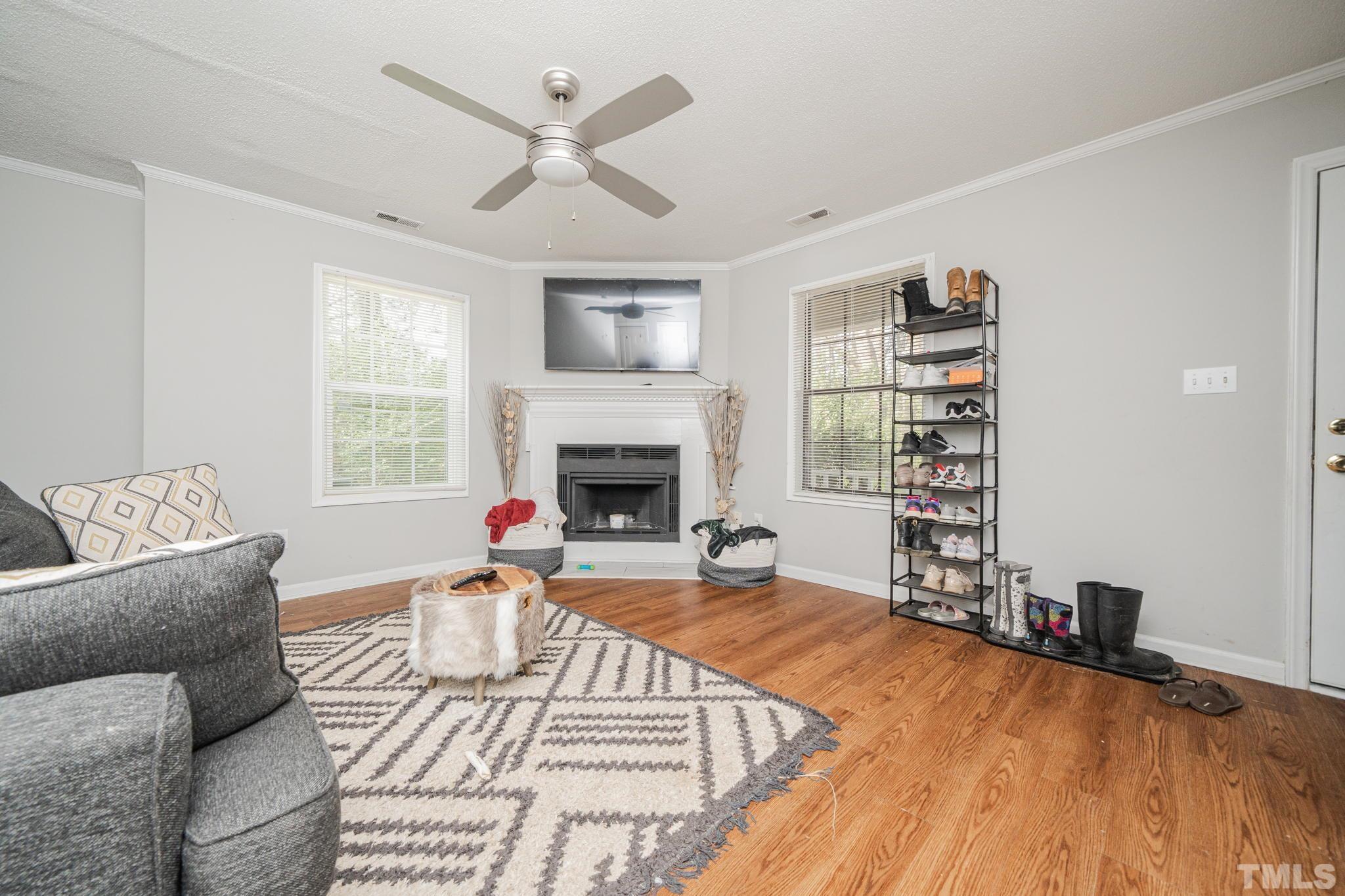 4304 Presley Court Raleigh, NC 27604 - Photo 14 of 34 a living room with furniture and a fireplace