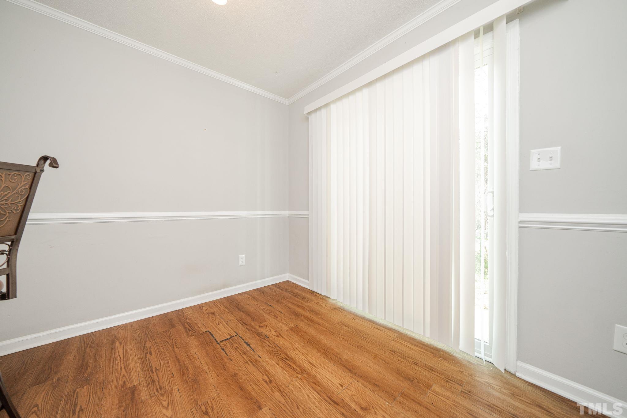 4304 Presley Court Raleigh, NC 27604 - Photo 19 of 34 a view of a small space with wooden floor and a window