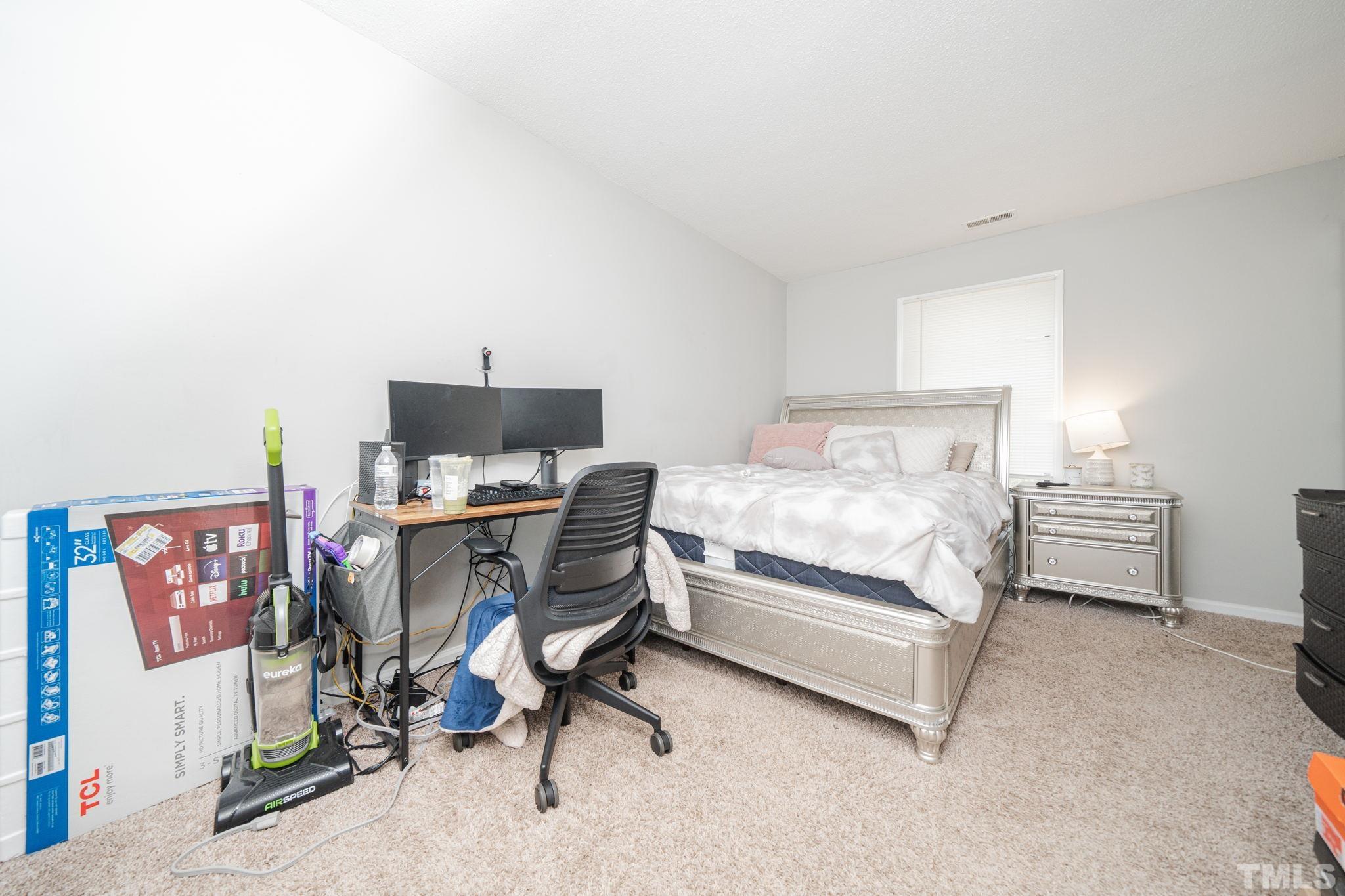 4304 Presley Court Raleigh, NC 27604 - Photo 21 of 34 a bedroom with a workspace