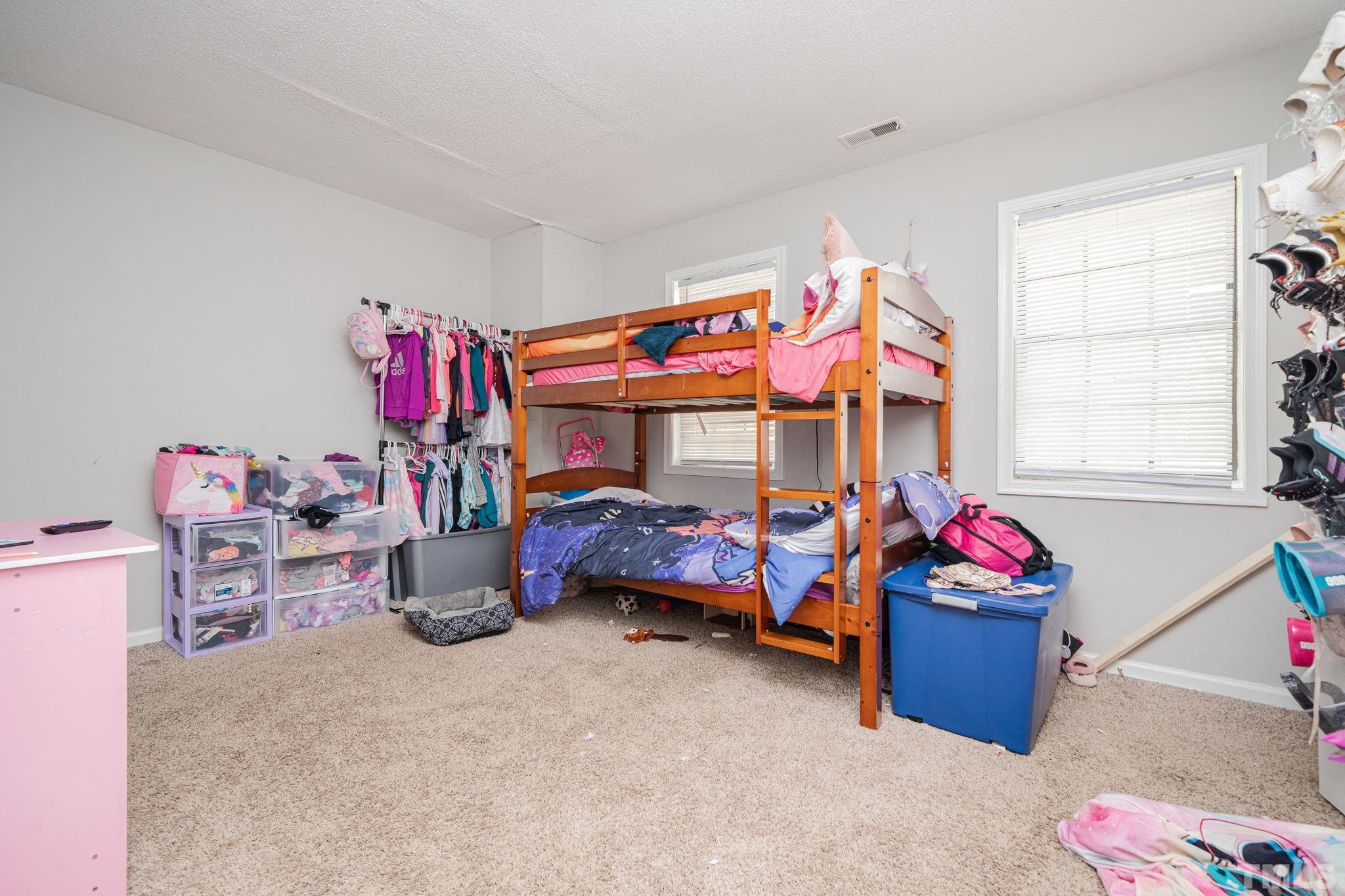 4304 Presley Court Raleigh, NC 27604 - Photo 25 of 34 a bedroom with furniture and a bathtub