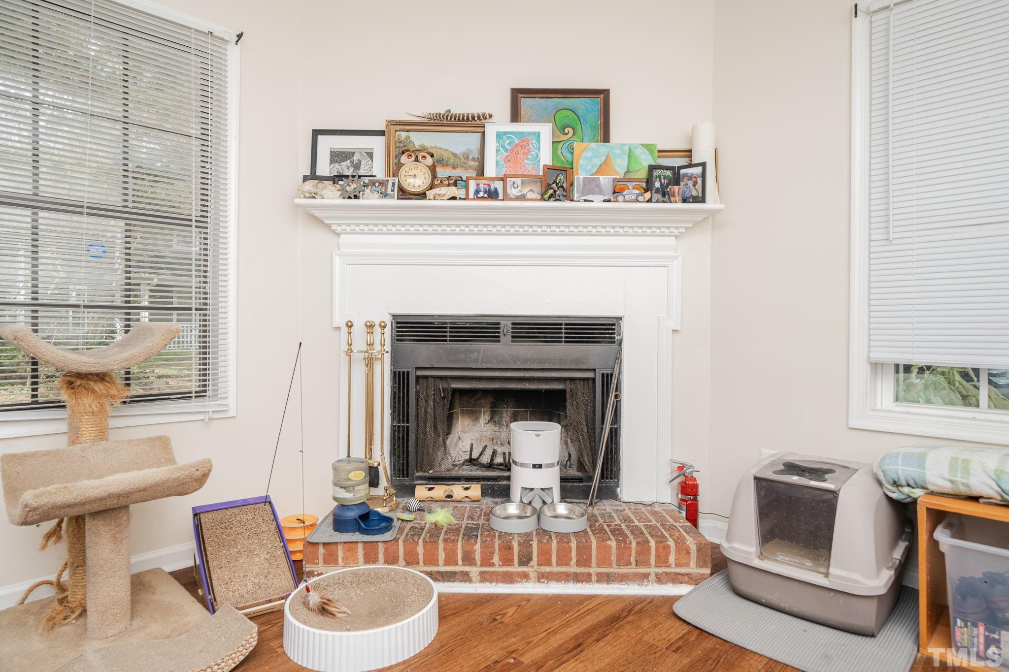 4304 Presley Court Raleigh, NC 27604 - Photo 28 of 34 a living room with furniture and a fireplace