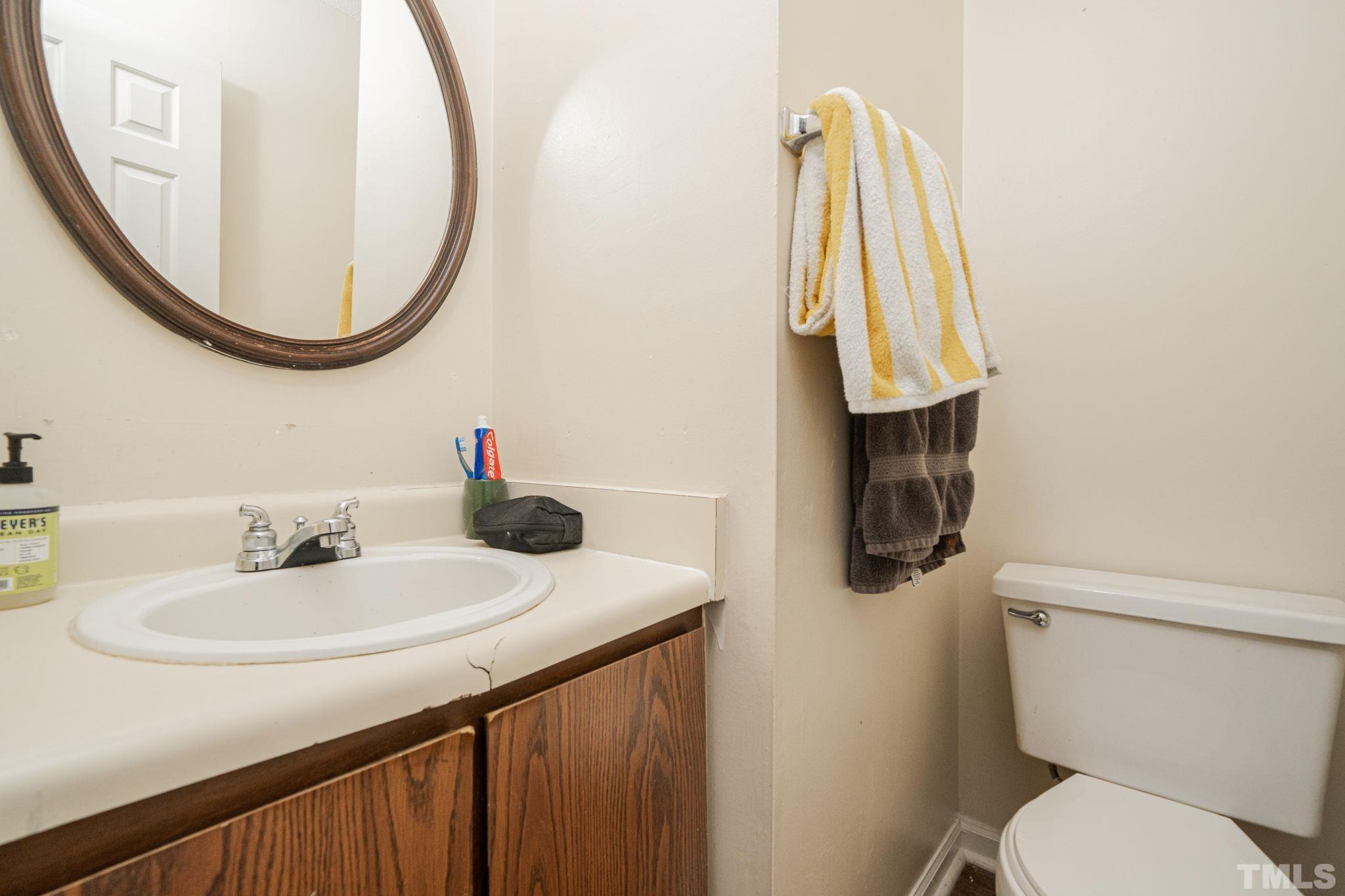 4304 Presley Court Raleigh, NC 27604 - Photo 31 of 34 a bathroom with a sink and a mirror