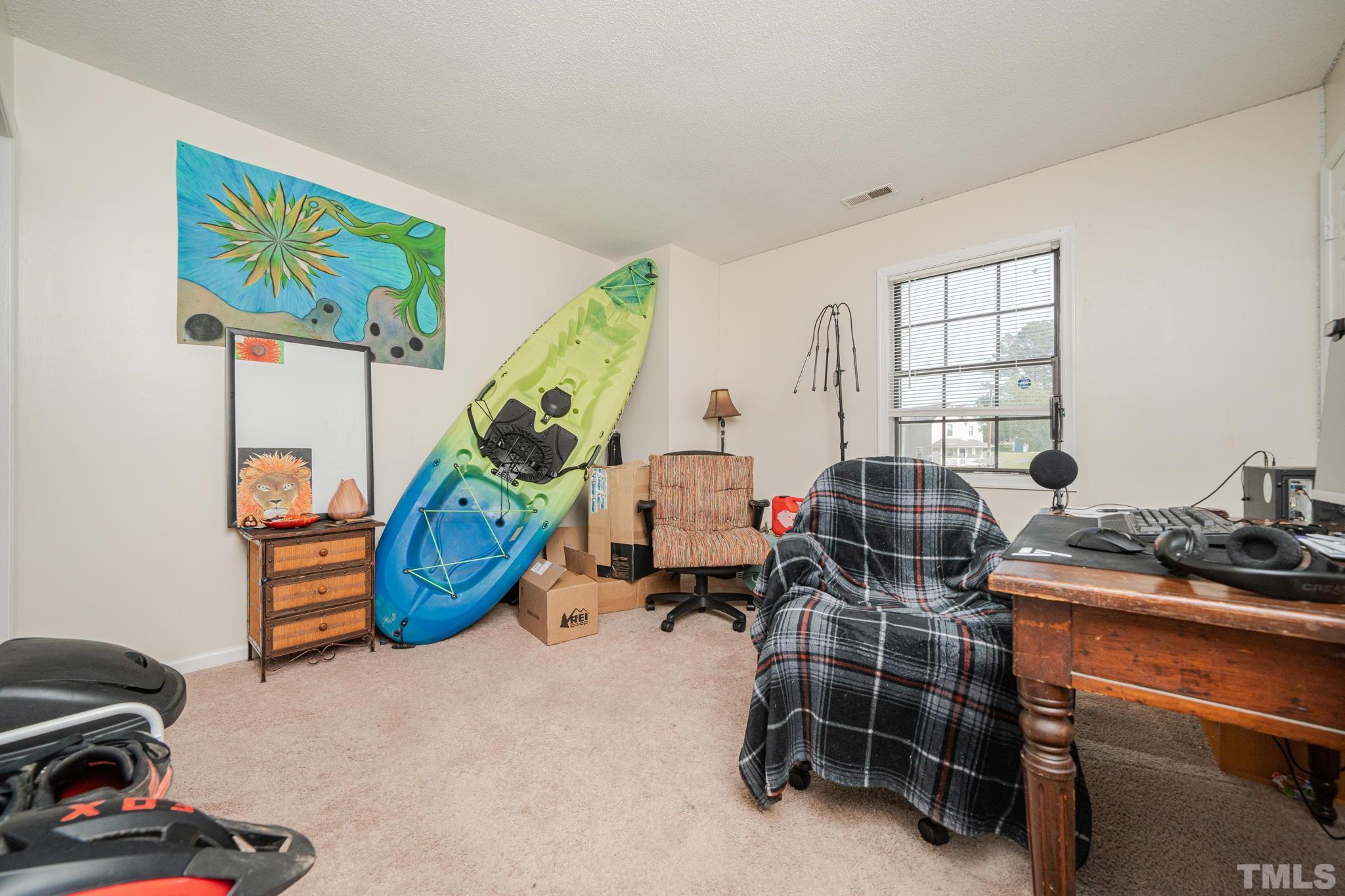 4304 Presley Court Raleigh, NC 27604 - Photo 33 of 34 a room with gym equipment and wooden floor