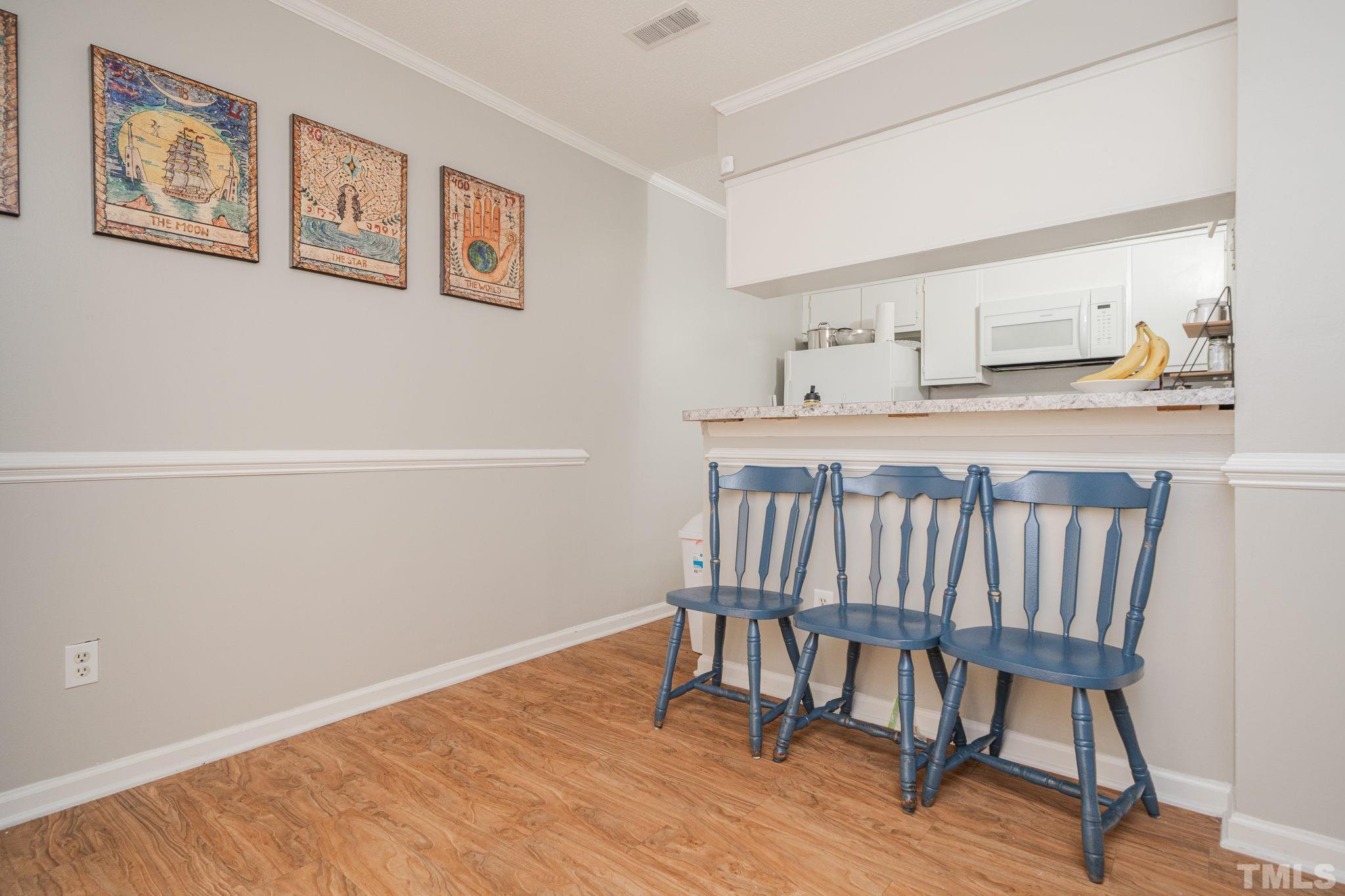 4304 Presley Court Raleigh, NC 27604 - Photo 6 of 34 a view of a room with wooden floor and a window
