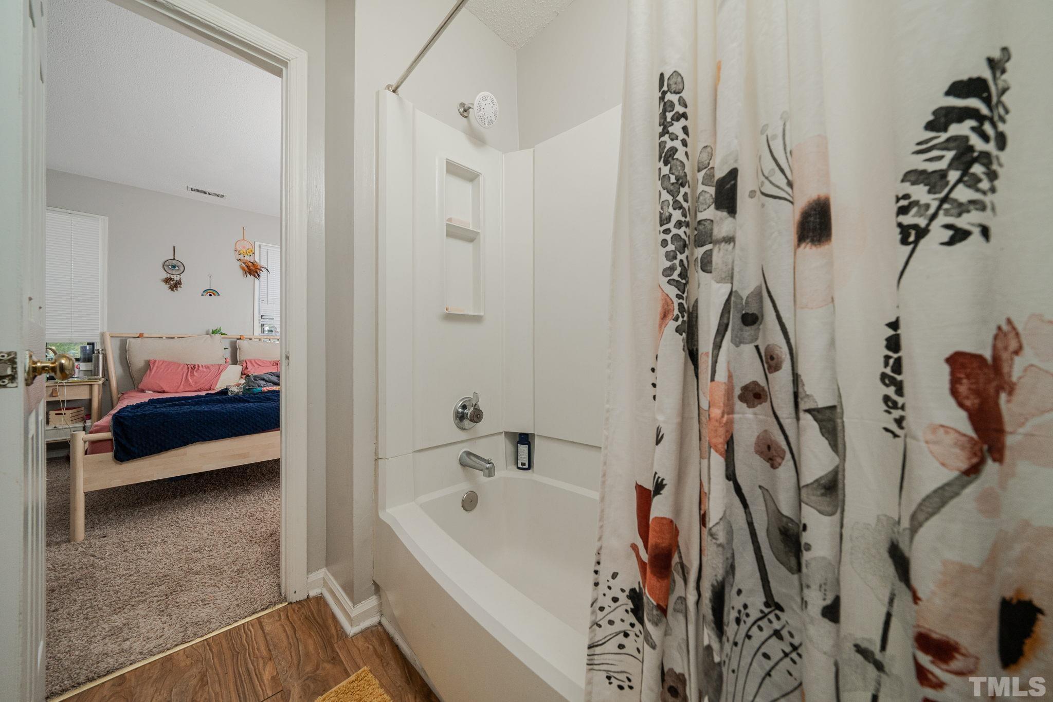 4304 Presley Court Raleigh, NC 27604 - Photo 10 of 34 a bathroom with a bathtub and shower