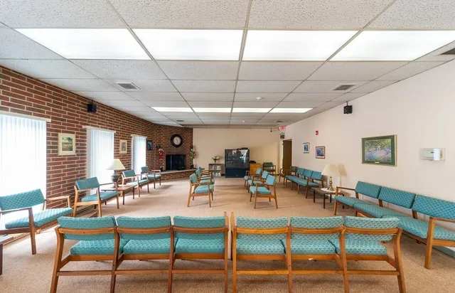 a room with furniture and a fireplace