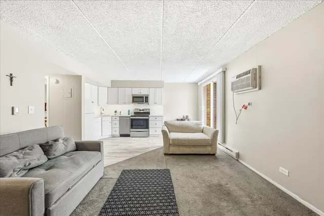 a living room with furniture and white walls