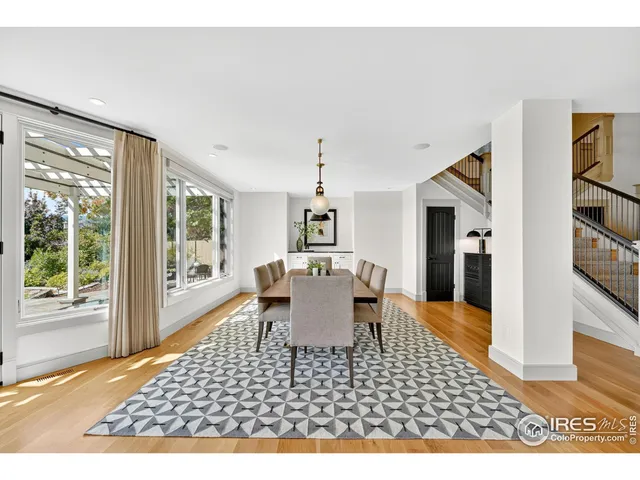 a living room with furniture rug and window