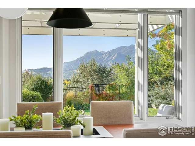 a front view of a house with a garden and pathway