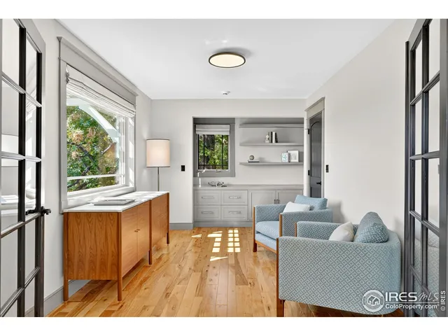 a view of living room with furniture and a large window