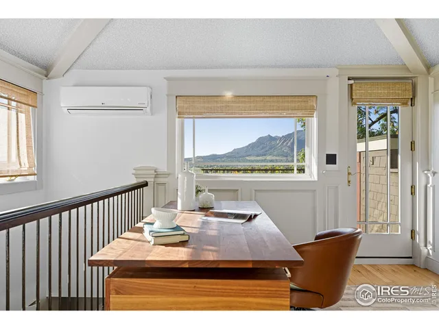 a view of a dining room with furniture and window