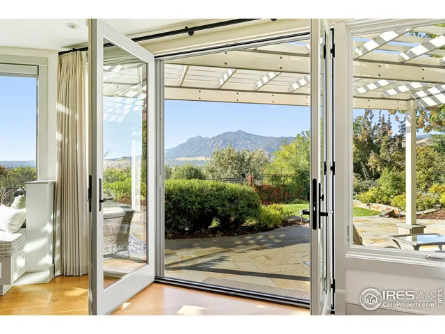 a view of a glass door and a living room