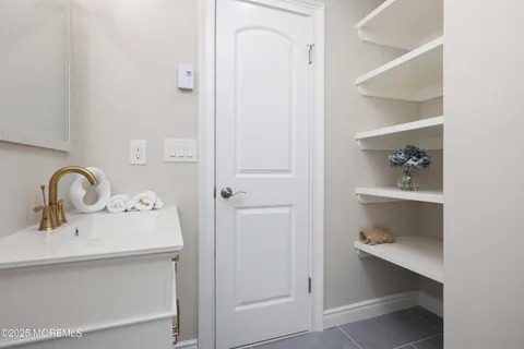 a bathroom with a sink and toilet