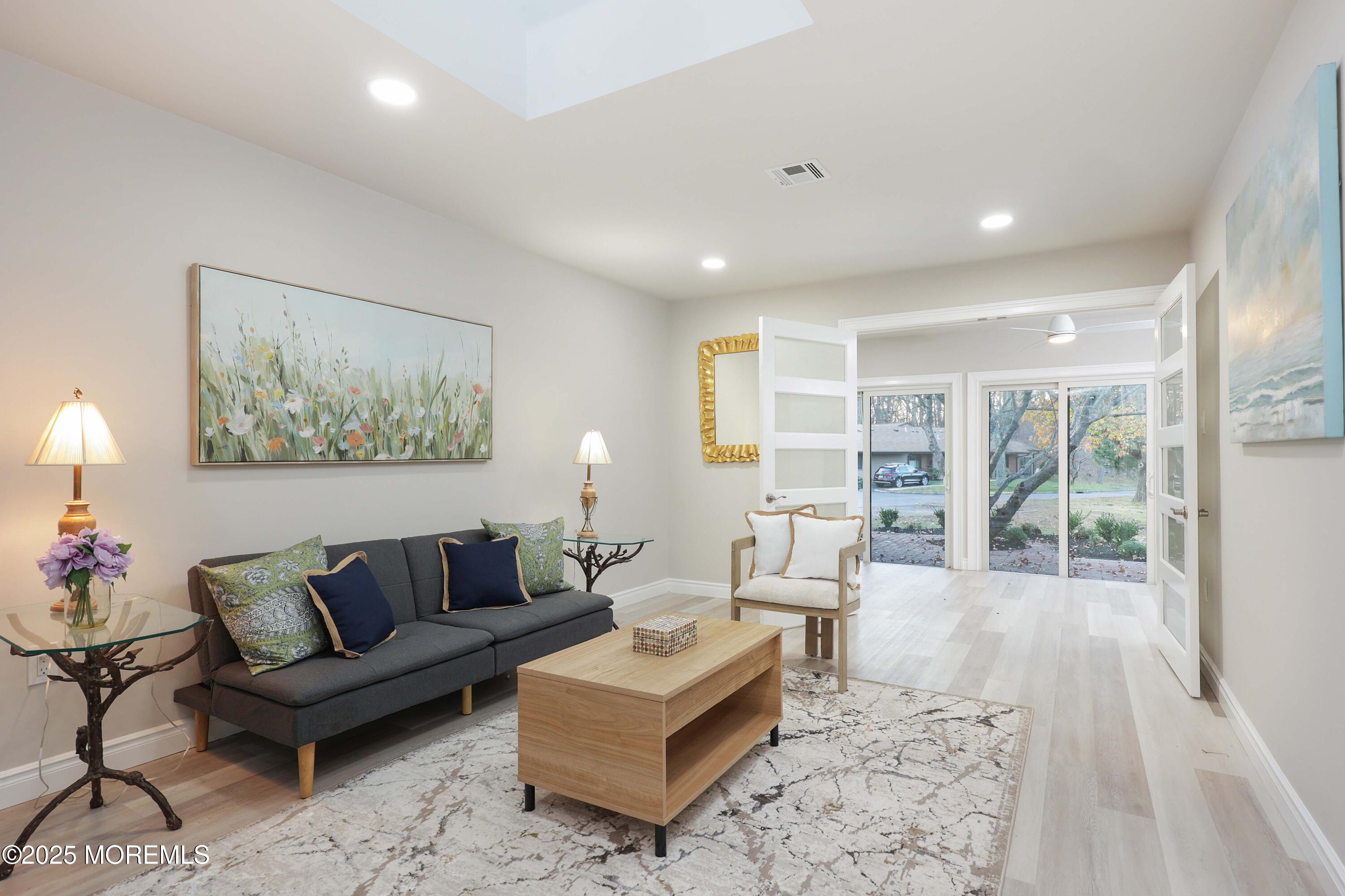 12 Ellsworth Court Red Bank, NJ 07701 - Photo 15 of 54 a living room with furniture and a large window