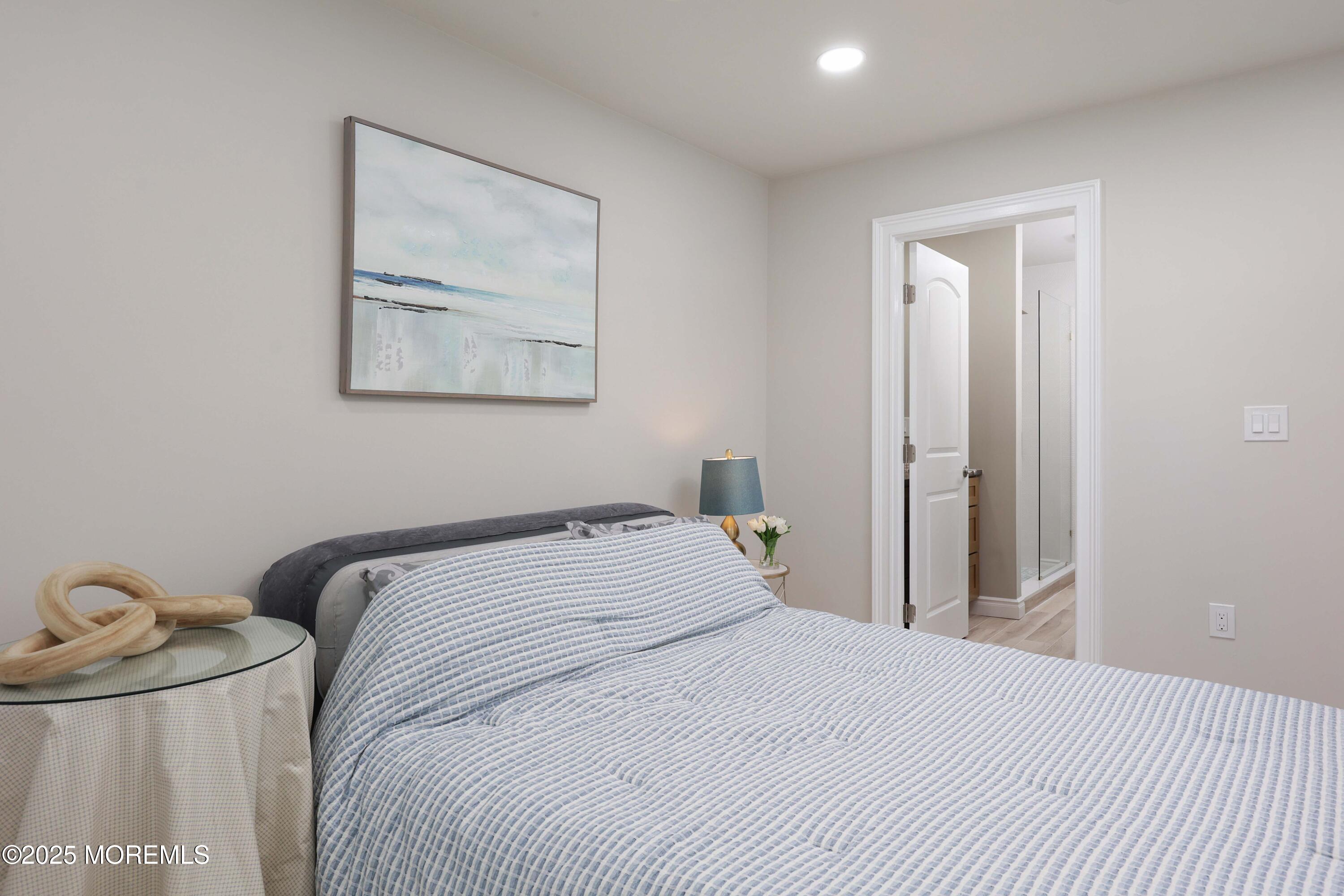 12 Ellsworth Court Red Bank, NJ 07701 - Photo 21 of 54 a bedroom with a bed and painting on the wall