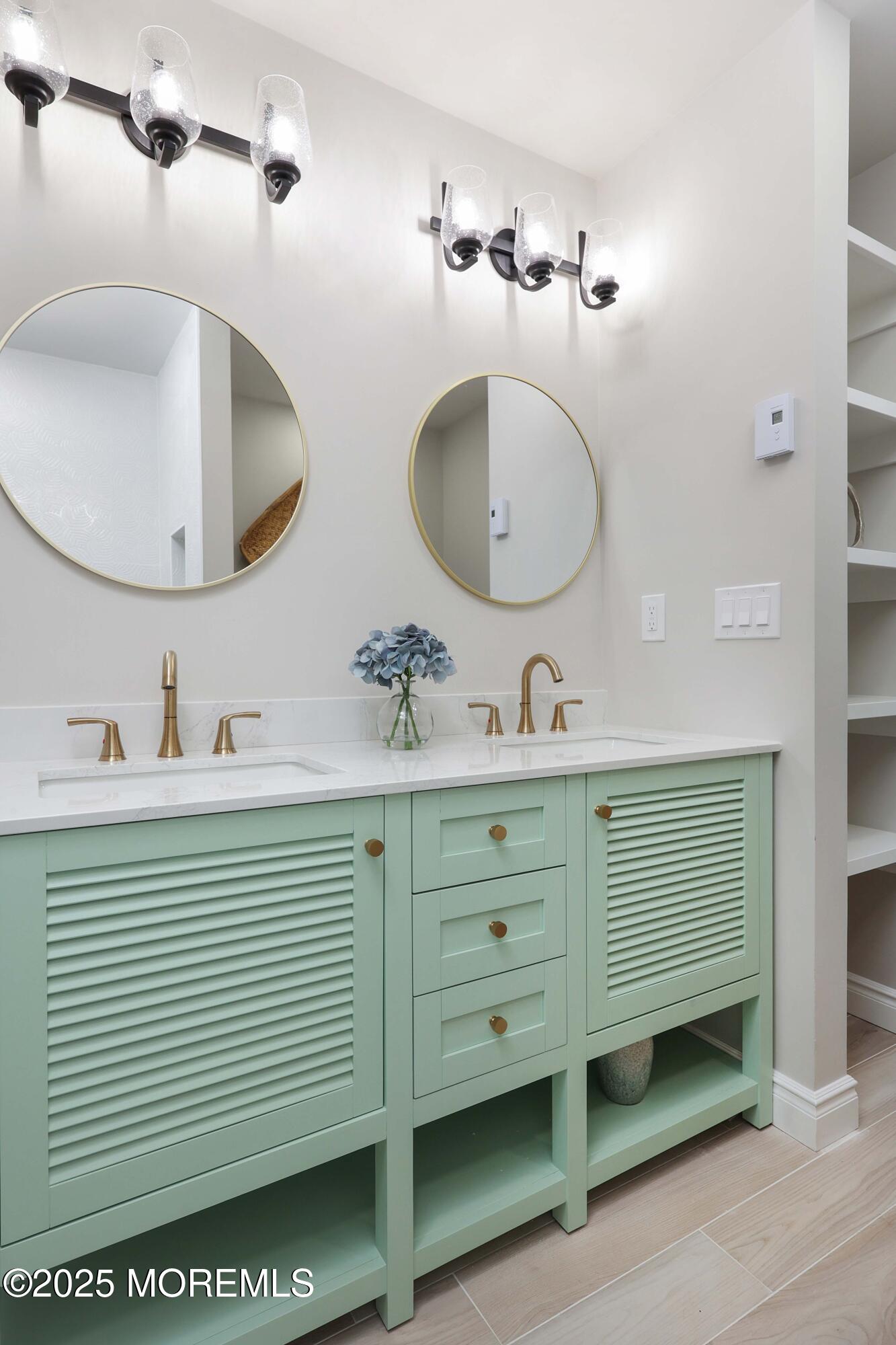12 Ellsworth Court Red Bank, NJ 07701 - Photo 26 of 54 a bathroom with a double vanity sink and a mirror