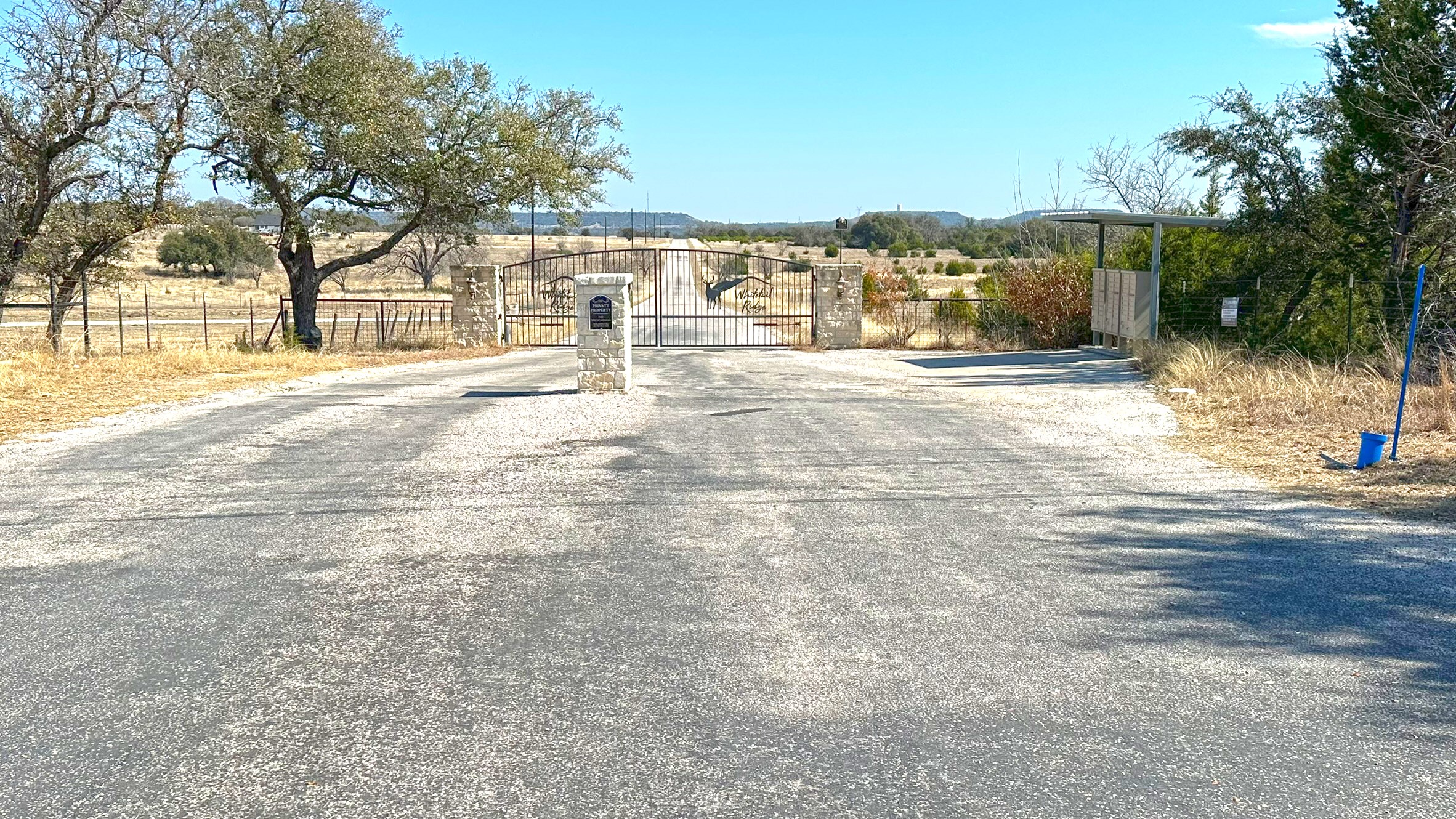 Tbd Whitetail Ridge Drive Kempner, TX 76539 - Photo 3 of 22 View of asphalt road with a gate and a view of countryside