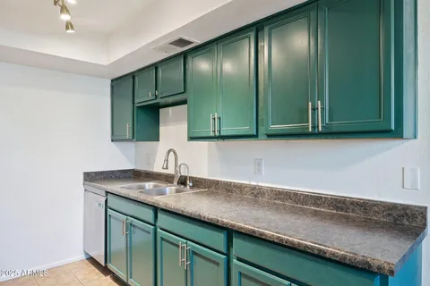 a bedroom with a bed and a potted plant