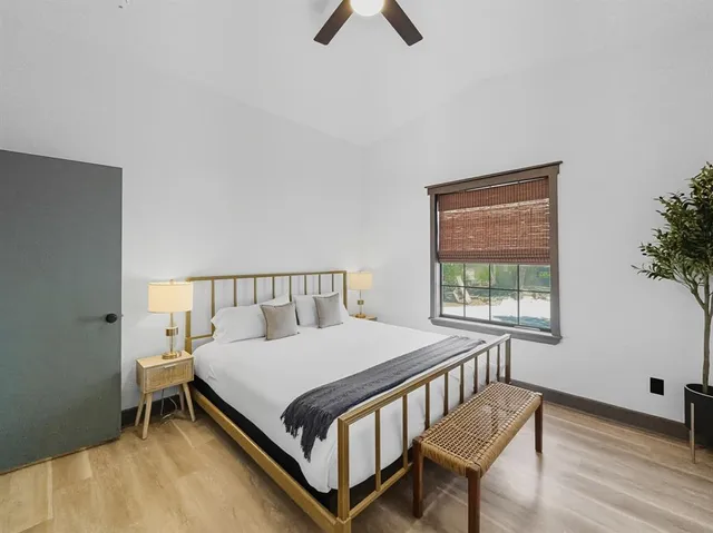 a bathroom with a toilet a sink a mirror and vanity