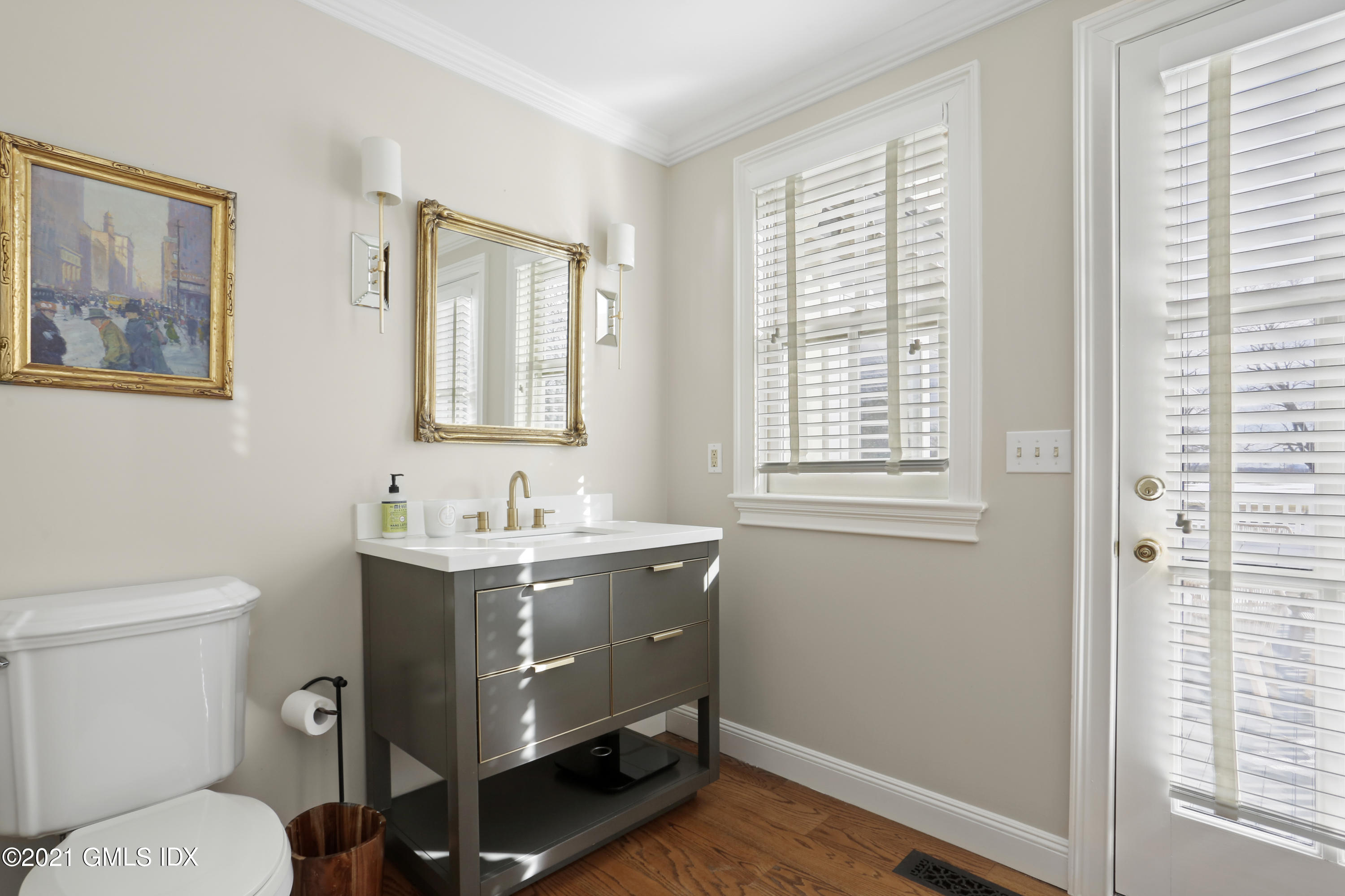 6 Golf Club Road Greenwich, CT 06830 - Photo 11 of 29 a bathroom with a granite countertop toilet a sink and a window