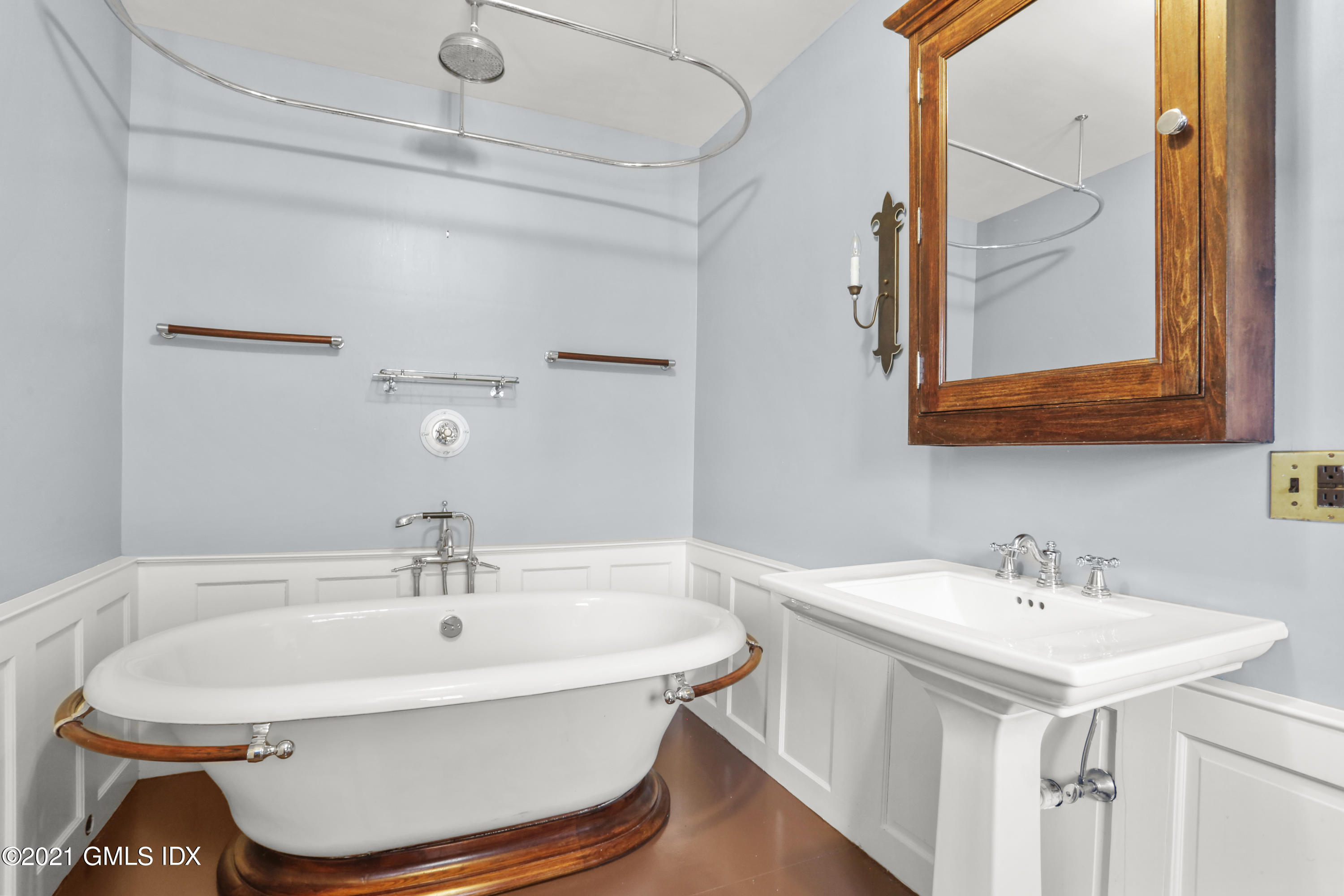 6 Golf Club Road Greenwich, CT 06830 - Photo 18 of 29 a bathroom with a sink and a mirror