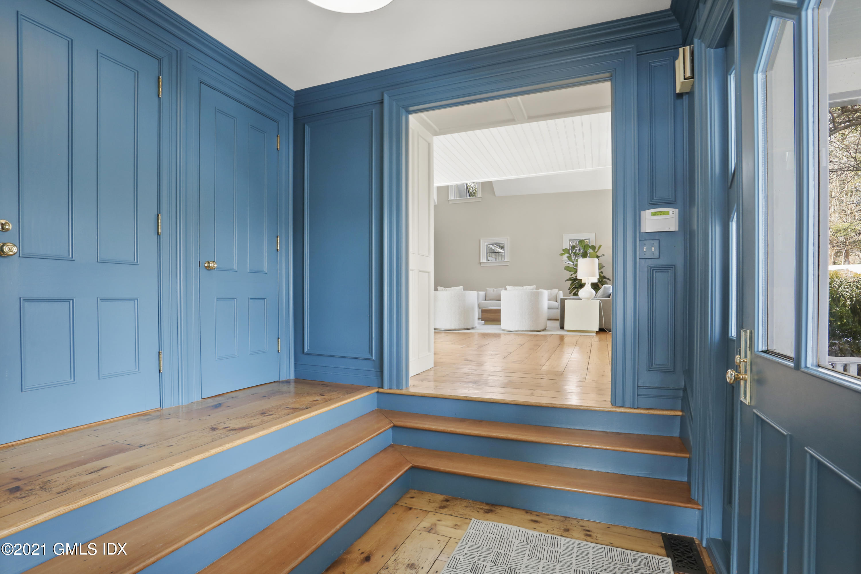 6 Golf Club Road Greenwich, CT 06830 - Photo 2 of 29 a bedroom with a bed and a chandelier