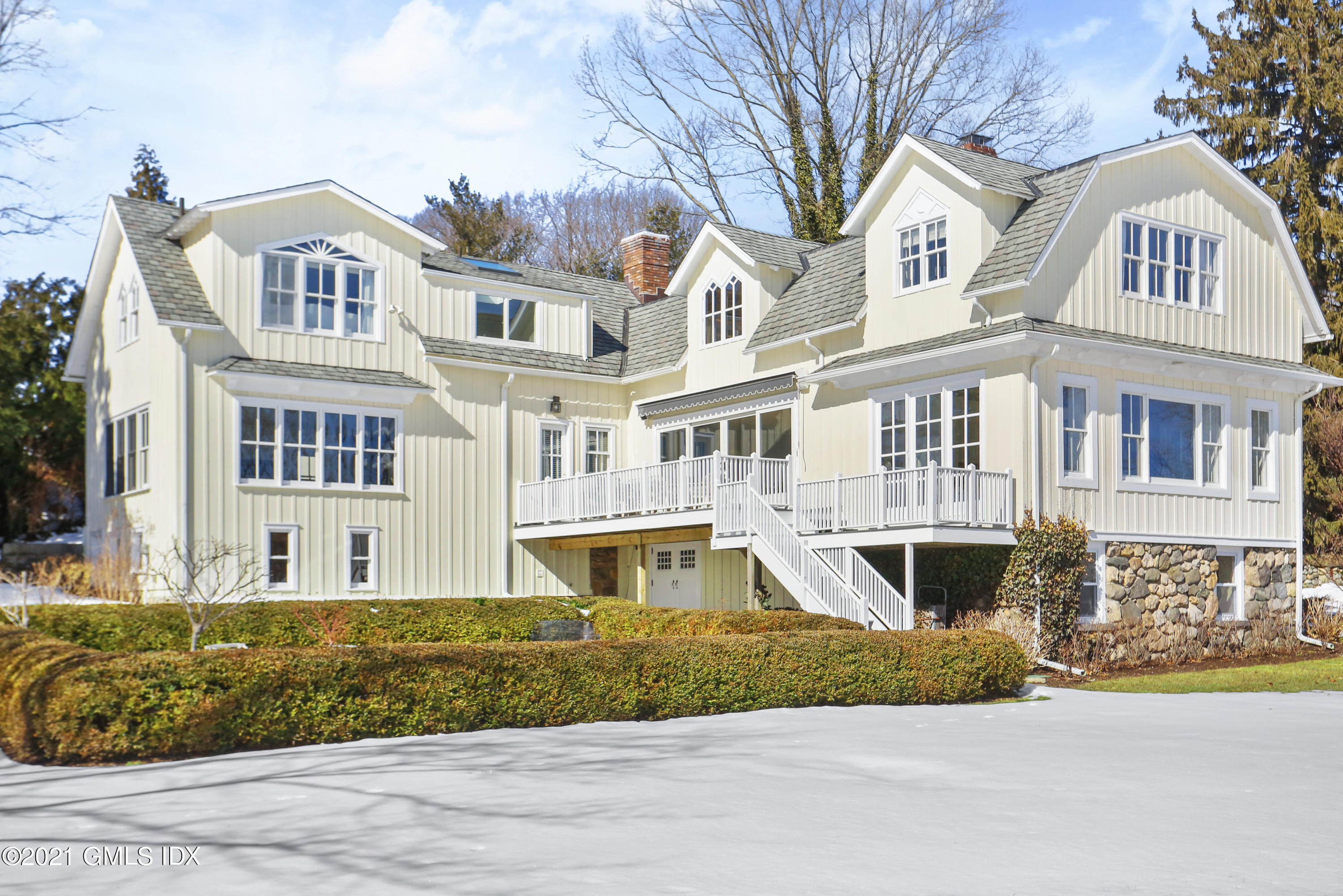 6 Golf Club Road Greenwich, CT 06830 - Photo 25 of 29 a front view of residential houses with yard