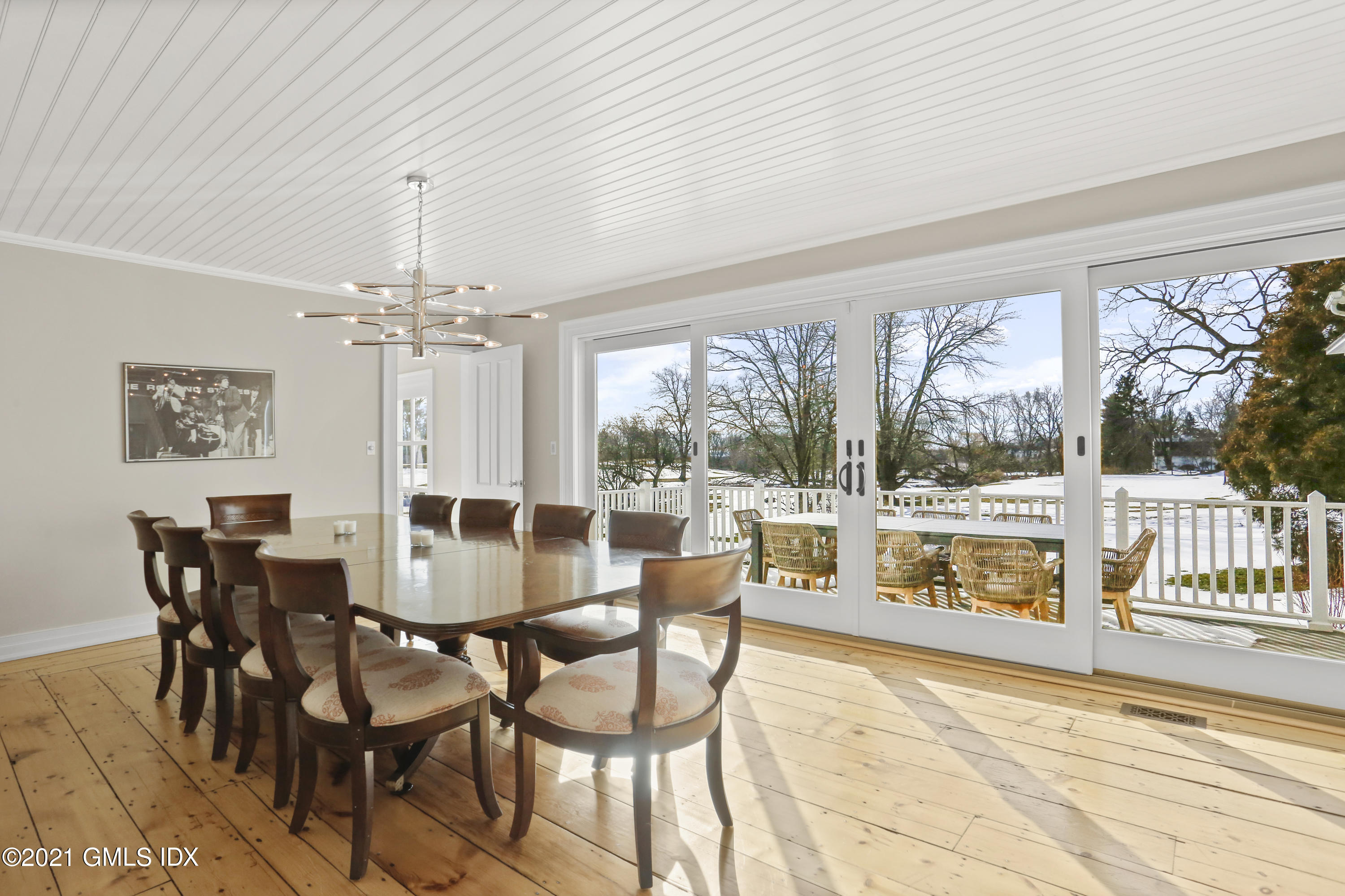 6 Golf Club Road Greenwich, CT 06830 - Photo 5 of 29 a view of a dining room with furniture large windows and wooden floor
