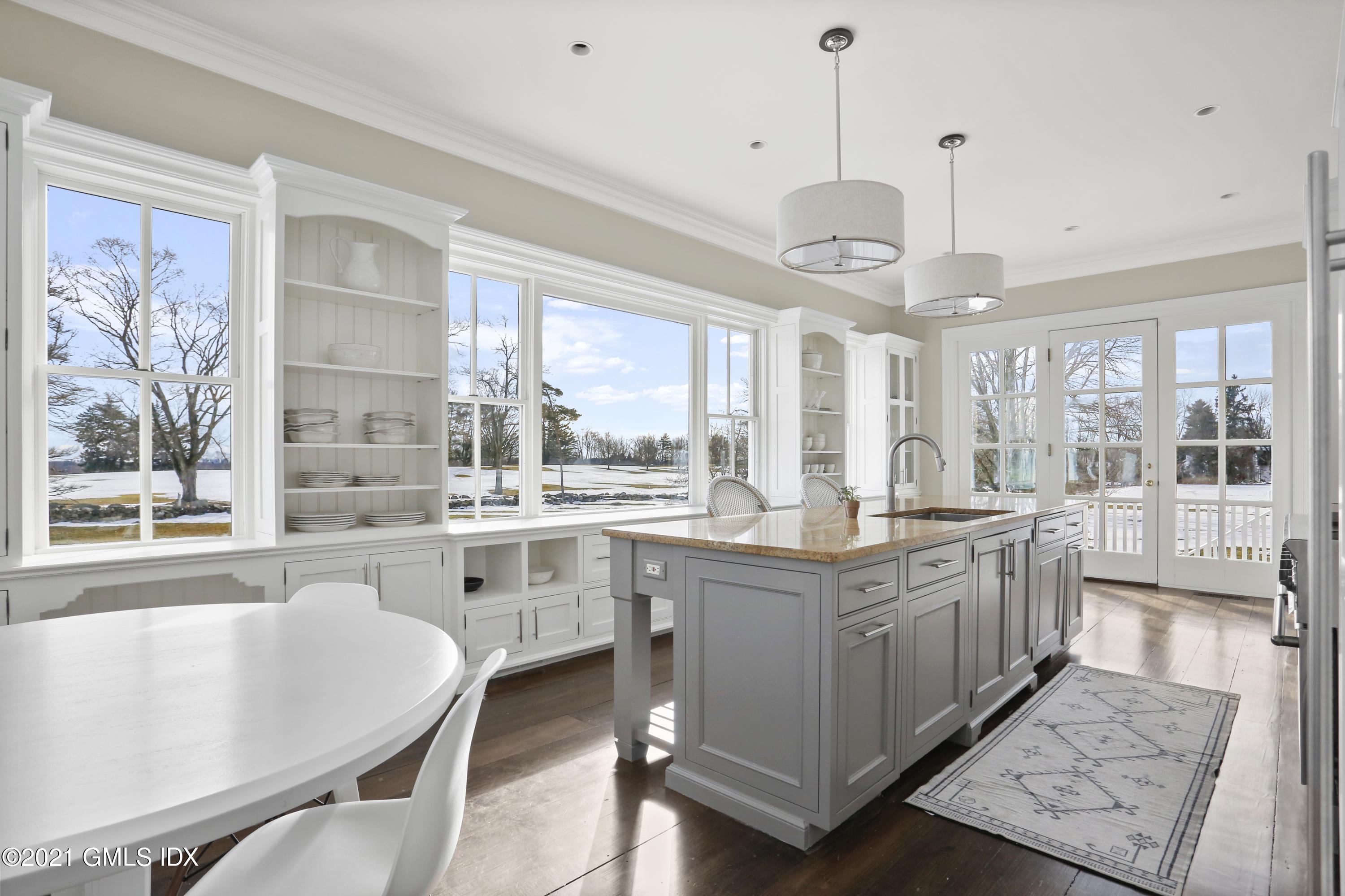 6 Golf Club Road Greenwich, CT 06830 - Photo 8 of 29 a large kitchen with kitchen island a large island in it