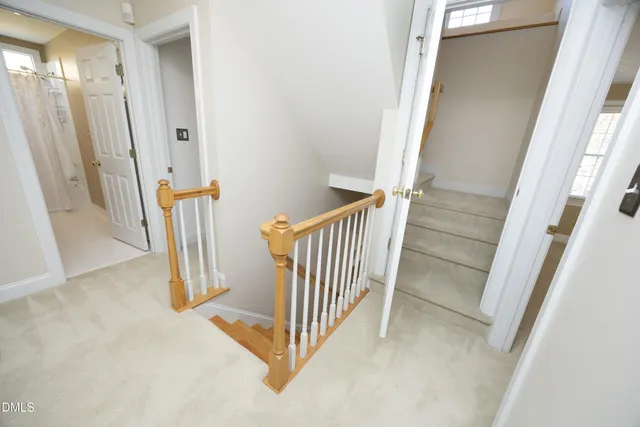 a view of a hallway with stairs