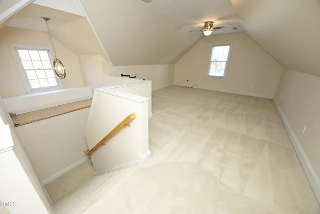 a view of a hallway with windows