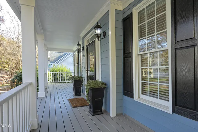 a view of a balcony with wooden floor