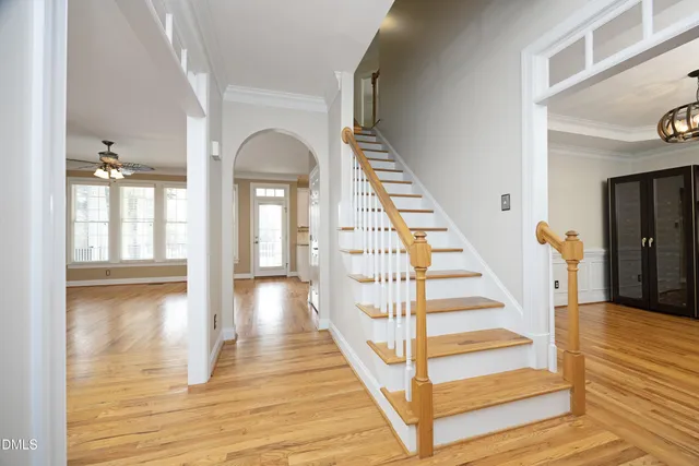 a view of entryway and hall with wooden floor