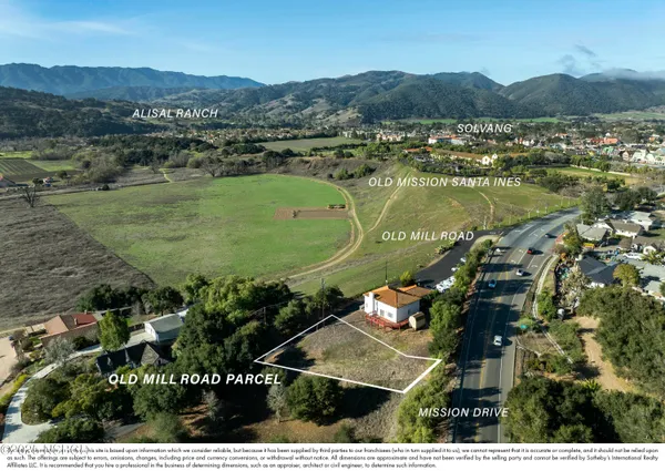 an aerial view of a house with a lake view