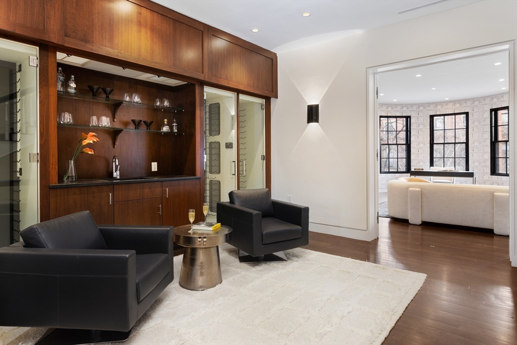 410 Beacon Street Boston, MA 02115 - Photo 11 of 35 a living room with furniture and a glass door