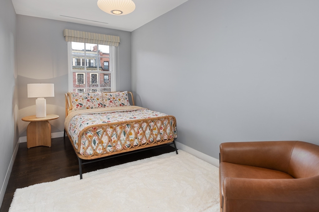 410 Beacon Street Boston, MA 02115 - Photo 20 of 35 a bedroom with a bed and window
