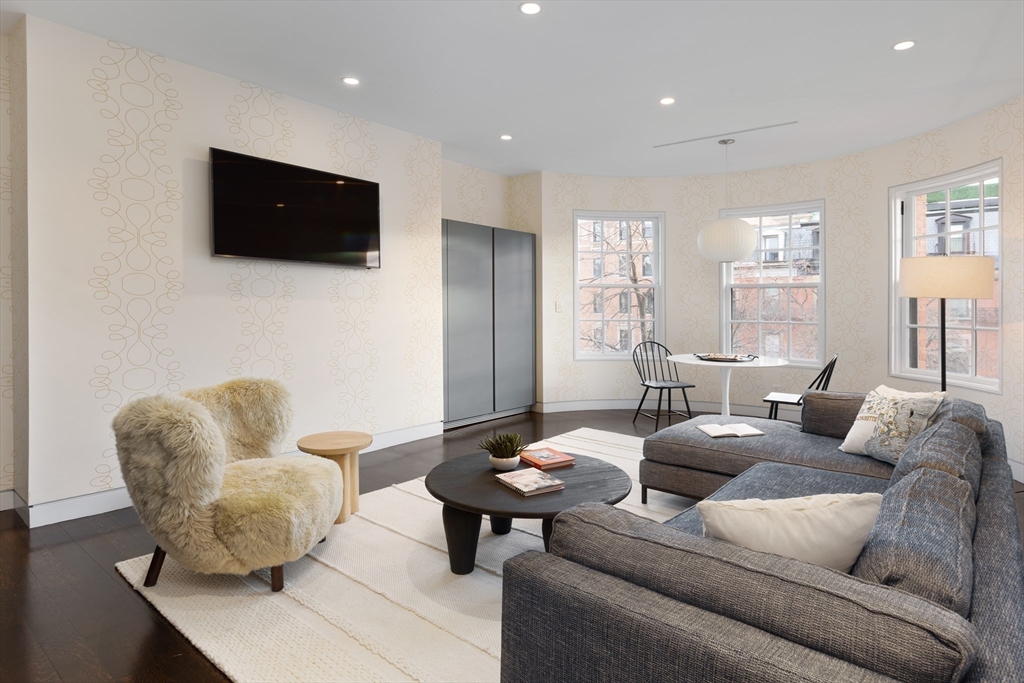 410 Beacon Street Boston, MA 02115 - Photo 21 of 35 a living room with furniture and a flat screen tv