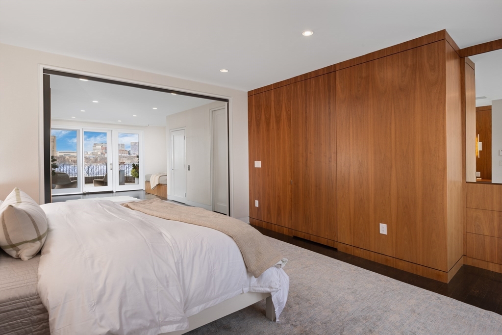410 Beacon Street Boston, MA 02115 - Photo 23 of 35 a spacious bedroom with a large bed and a window