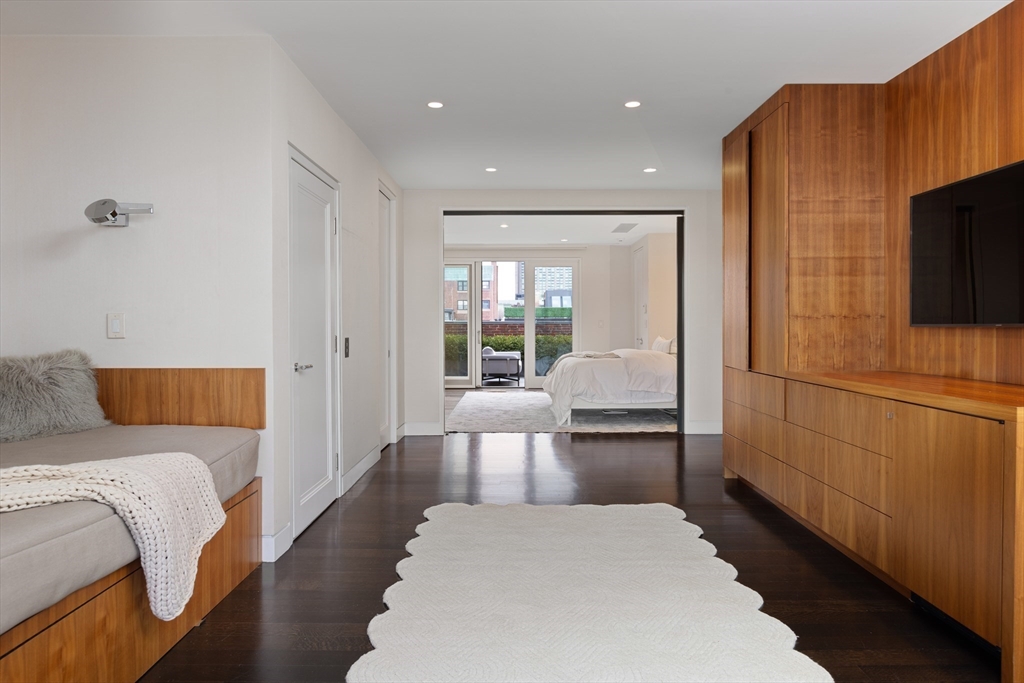 410 Beacon Street Boston, MA 02115 - Photo 24 of 35 a bedroom with a bed and a flat screen tv