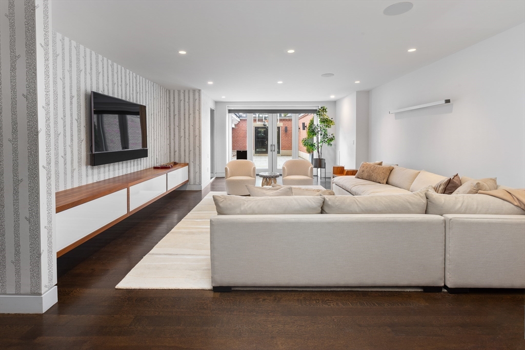 410 Beacon Street Boston, MA 02115 - Photo 32 of 35 a living room with furniture and a flat screen tv