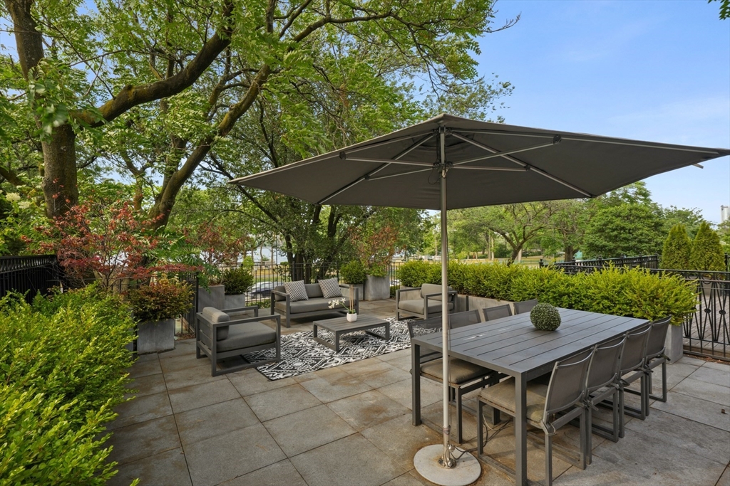 410 Beacon Street Boston, MA 02115 - Photo 7 of 35 a view of backyard of house with seating space