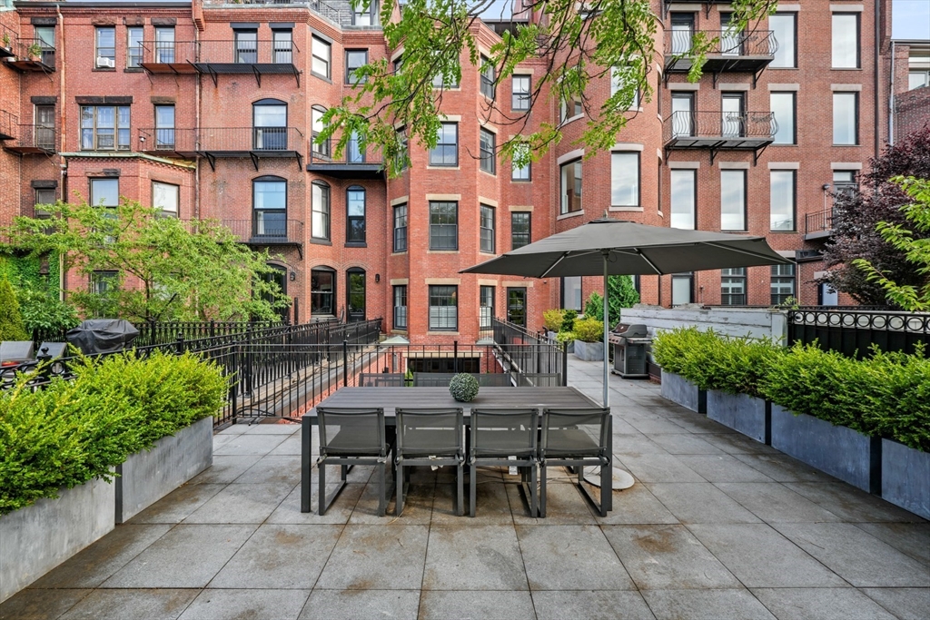 410 Beacon Street Boston, MA 02115 - Photo 8 of 35 a view of a building with a patio