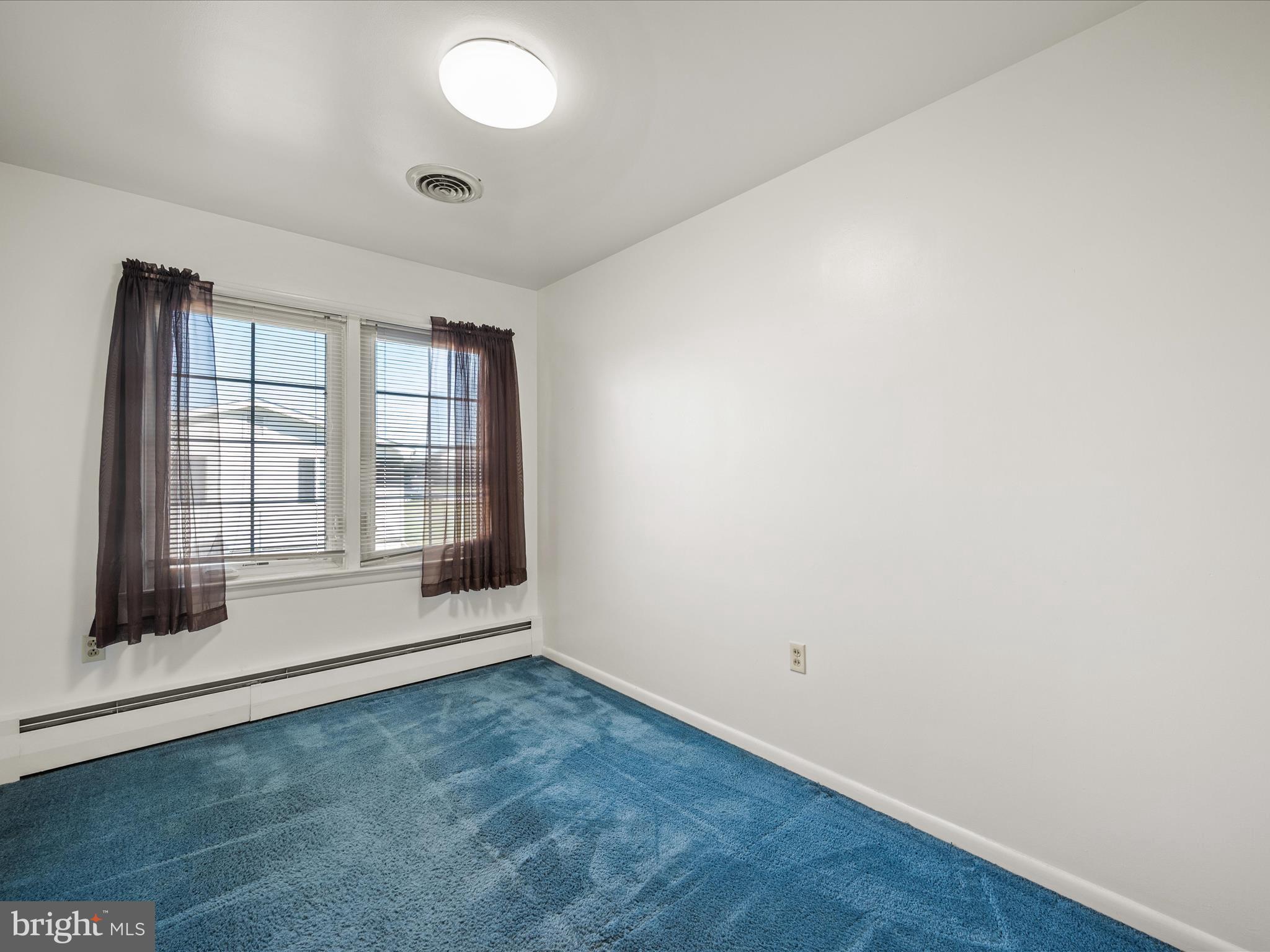 272 Jefferson Terrace Road Charles Town, WV 25414 - Photo 16 of 34 an empty room with wooden floor and windows