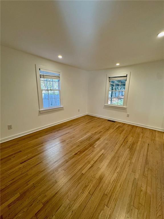 635 Valley Brook Road Decatur, GA 30033 - Photo 12 of 17 an empty room with wooden floor and windows