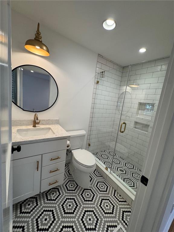 635 Valley Brook Road Decatur, GA 30033 - Photo 14 of 17 a bathroom with a sink mirror vanity and toilet